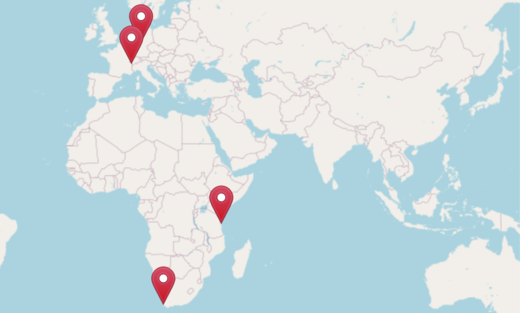 Teaserbild mit Verlinkung zum Wanderweg-Menü: eine Weltkarte mit mehreren Standort-Icons